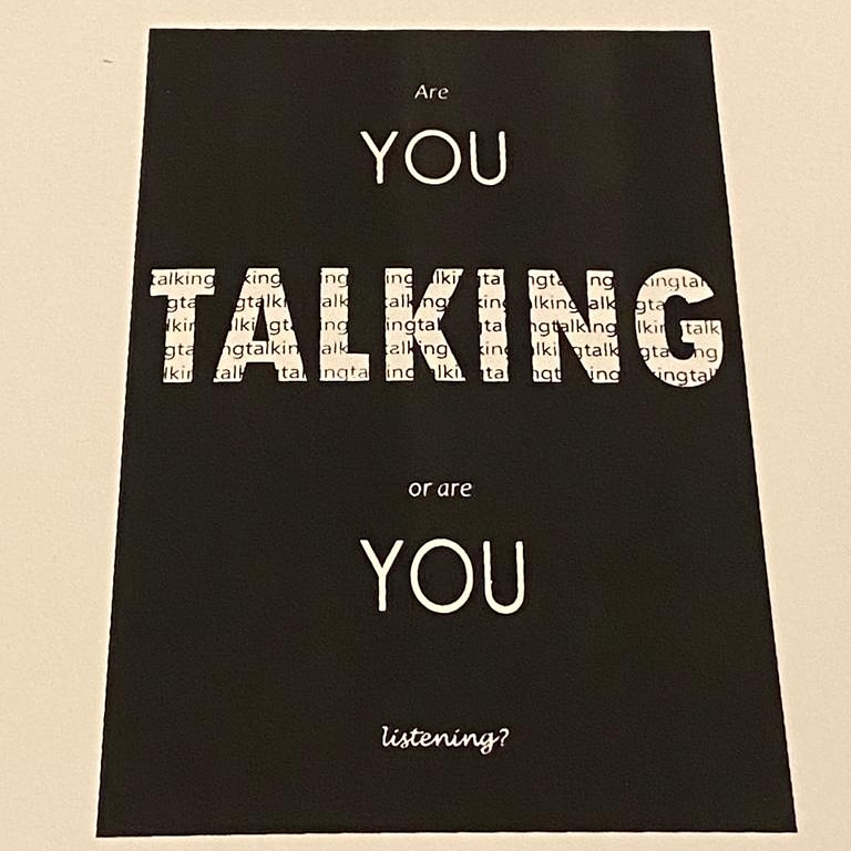 A print with the words 'Are you talking or are you listening'