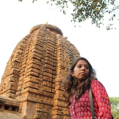 Shreya Sharma standing in front of a monumental structure